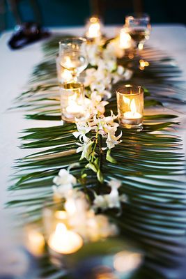 Simple but very elegant orchid runner.  Palm fronds laid down the center of the table with dendrobium orchids laid on top.  You could do it in any of the colors that dendrobium orchids come in naturally- white, green or purple would be beautiful! PERFECT Jamaica Wedding, Rustic Wedding Decorations, Tafel Decor, Fiesta Tropical, Wedding Photo Gallery, Dendrobium Orchids, Reception Centerpieces, Green Table, Hawaiian Wedding