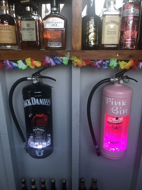 Had two empty fire extinguisher so thought i could use them in my garden bar Lighted Bottles, Bar Deco, Ideas For Front Of House, Front Yard Landscaping Australian, Diy Home Bar, Pink Gin, Landscaping Simple, Landscaping Flowers, Home Bar Designs