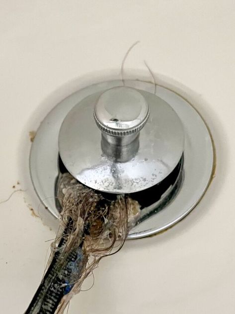 Clogged shower drains are an issue we have all dealt with at one point or another. There are so many products available these days to help rid the clogs, but many of them involve strong chemicals or expensive equipment. This simple method explained below has never failed me, and always produces drastic results! WARNING- if you are squeamish or easily grossed out, do not scroll too far down. I almost did not want to show what came out of our drain out of embarrassment, but the results a… Unclog Tub Drain, Unclog Shower Drain, Clogged Shower Drain, Cleaning Drains, Unclog Bathtub Drain, Clogged Drain Bathtub, Dresser In Closet, Clean Kitchen Cabinets, Bathroom Crafts