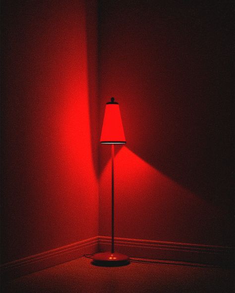 Amid the chaos and excitement of the set, the crimson glow of the red lamp casts a warm, inviting light on the scene. Red Bedroom Lights, Red Light Lamp, 2025 Graphic, Red Lamps, Spooky Soiree, Red Light Bulbs, Monochromatic Interior, Moody Lighting, Red Lighting