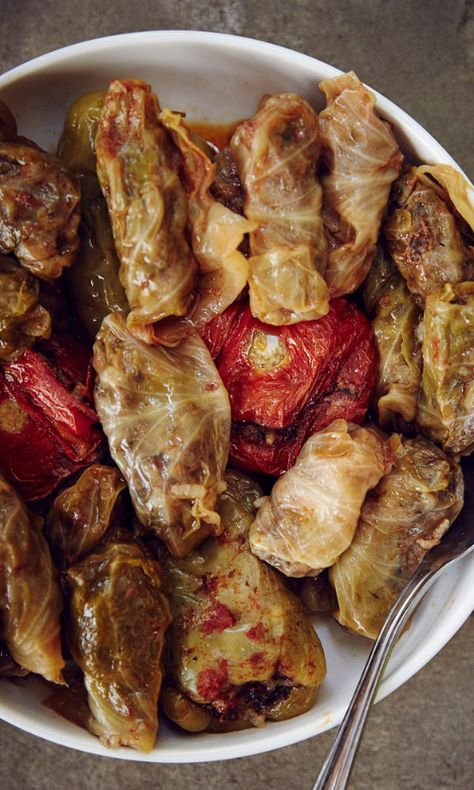 In Armenian and nearby Middle Eastern cuisines, dolma refers to a family of stuffed vegetable dishes, most often wrapped in grape or cabbage leaves. You can use this same meat-and-rice filling—and a similar steaming technique—to hollow out and stuff zucchini, eggplant, tomatoes, or peppers. Dolmas taste best warm, and leftovers can be resteamed one or more times as desired. Stuff Zucchini, Assyrian Food, Arabisk Mad, Eat Greek, Iranian Cuisine, Middle East Food, Middle East Recipes, Armenian Recipes, Cabbage Rolls Recipe