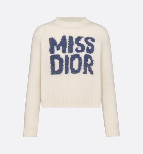 The sweater features the blue Miss Dior Graffiti motif, a nod to the 1967 debut ready-to-wear collection and a manifesto to Maria Grazia Chiuri's signature celebration of feminism. Crafted in an ecru cashmere and silk knit, it has a ribbed hem and cuffs. The round-neck sweater can be worn with casual outfits in any season and will pair well with other Miss Dior Graffiti creations. Dior Knitwear, Dior Knit Sweater, Luxury Winter Sweater By Miu Miu, Vintage Dior Sweatshirt, Dior Fall 2022 Sweater, Denim Swimsuit, Short Denim, Stole Scarf, Silk Knit