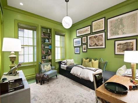 Fantastic boy's bedroom features walls painted bright green lined with a collection of framed maps over a long black daybed with storage drawers dressed in white and brown hotel duvet and shams along with a gray flannel blanket and green pillows with turquoise trim. Boys Bedroom Green, Lime Green Bedrooms, Green Boys Room, Modern Boys Rooms, Interior Design Green, Lime Green Walls, Turquoise Bedroom, Boys Wall Decor, Green Bedrooms