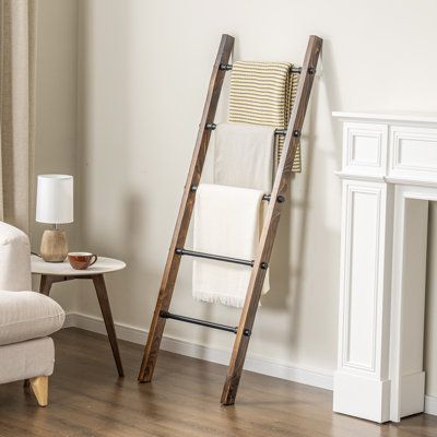 Introducing a versatile addition to your bathroom, this rustic burnt wood standing bathroom ladder towel rack features 5 metal rungs, perfect for drying delicates or displaying towels and blankets. Its solid burnt wood frame adds a charming rustic accent while offering stability and durability. With no installation required, this free-standing towel rack can be easily moved from room to room, complementing rustic, vintage, industrial, or contemporary decor. Providing ample storage and display sp Towel Storage In Bathroom, Towel Ladder Bathroom, Ladder Towel Racks, Long Bathroom Rugs, Long Bathroom, Wood Towel Rack, Standing Towel Rack, Bathroom Ladder, Free Standing Towel Rack