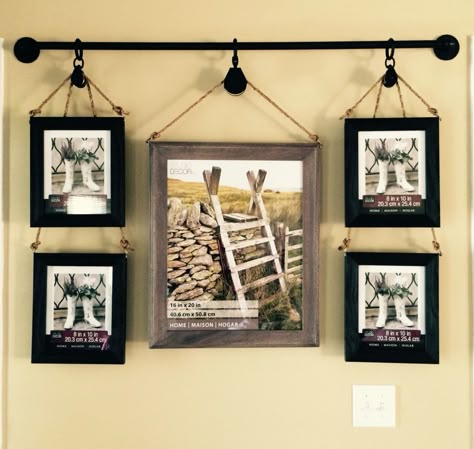 I saw a lot of great ideas but I came up with the idea of using dual pulleys. After hanging picture frames from 1/2" pipe and flanges...it became a masterpiece! Picture Frame Hanging Ideas, Farmhouse Picture Frame Ideas, Ideas For Hanging Pictures, Hanging Pictures Ideas, Picture Hanging Ideas For Bedroom, Frame Hanging Ideas, Industrial Picture Hanging Ideas, Industrial Picture Frames, Picture Hanging Ideas