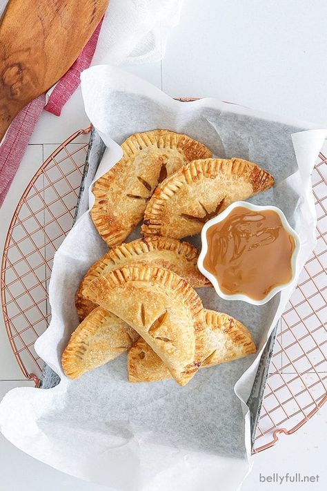 These Air Fryer Apple Hand Pies are portable and delicious! With an easy apple pie filling and flaky crust, they’re such a fun Fall dessert with no slicing and little mess. For an added treat, dunk them in homemade caramel sauce! Blueberry Trifle Recipe, Easy Apple Pie Filling, Fun Fall Desserts, Air Fryer Cake Recipes, Apple Pie Filling Recipes, Air Fryer Recipes Dessert, Fried Apple Pies, Homemade Apple Pie Filling, Homemade Pie Crust Recipe