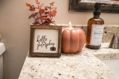 Rustic fall bathroom, fall decor, bathroom styling, bathroom decor Fall Bathroom Counter Decor, Simple Fall Bathroom Decor, Autumn Bathroom Decor, Fall Bathroom Decor Ideas, Minimalist Fall Decor, Fall Bathroom Decor, Natural Fall Decor, Halloween Bathroom Decor, Fall Bathroom