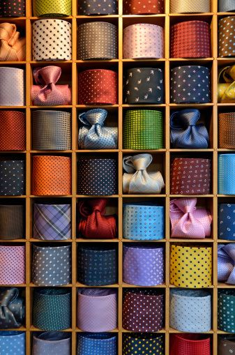 neckties Mens Store Display, Tie Storage, Clothing Store Displays, Suit Stores, Clothing Store Interior, Dark Suit, Clothing Store Design, Retail Store Display, Visual Merchandising Displays