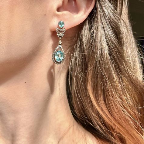 Friday Feature✨ We're in love with these gorgeous aquamarine droppers!🤍 A fabulous pair of Edwardian inspired drop earrings featuring four gorgeous blue zircons, accompanied by glistening rose cut diamonds. The elaborate galleries are fashioned in sterling silver and have been gilded in 18ct yellow gold on the back along with the butterfly studs. They look spectacular dangling from the ear and would be perfect for a wedding or glamorous occasion. For 24 hours ONLY you can make this piece ... Aquamarine Earrings, Blue Zircon, The Butterfly, Rose Cut Diamond, Antique Jewellery, Rose Cut, Aquamarine, Diamond Cuts, In Love