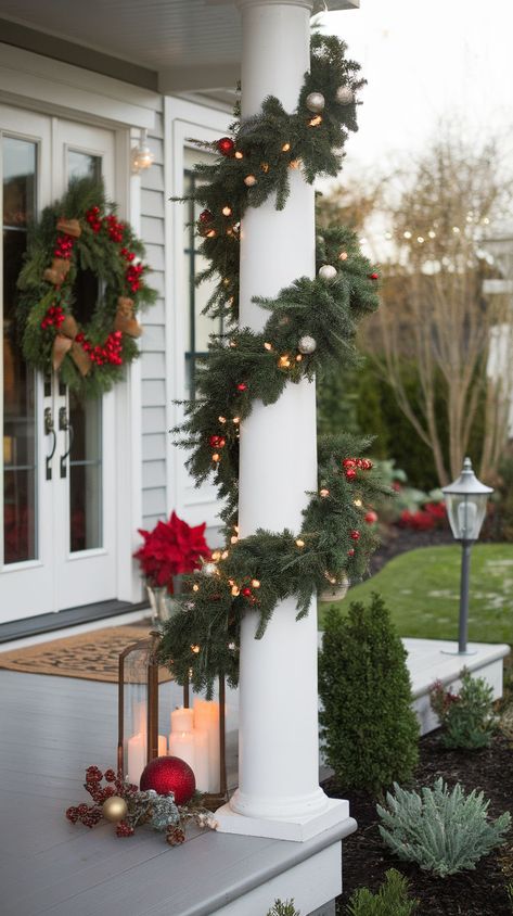 Elevate your outdoor holiday decor with these 18 elegant Christmas porch decor ideas. From stylish wreaths and sophisticated lighting to luxurious garlands and oversized ornaments, these ideas will add a touch of class to your front porch. Christmas Decor Pillars Outdoor, Christmas Porch Columns Decorating Ideas, Porch Columns Christmas Decor, Porch Pillar Christmas Decor, Outdoor Pillar Christmas Decorations, Christmas Columns Outdoor, Outdoor Christmas Garland Ideas, Wrapping Porch Columns, Christmas Cards Aesthetic