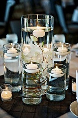 DISPLAY :: Floating candles w/ twigs & tall glasses/vases Floating Candle Centerpieces Diy, Diy Floating Candles, Floating Candle Centerpieces, Candles Wedding, Tafel Decor, Tall Flowers, Diy Candle Holders, Bohol, Deco Floral