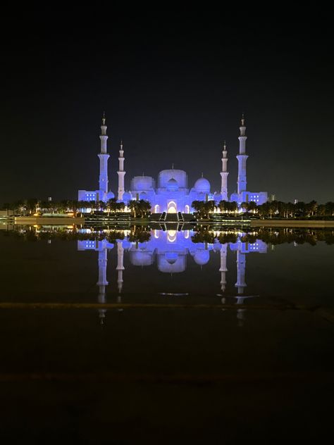 Photo of the Sheikh Zayed Grand Mosque in Abu Dhabi glowing at night. Water reflection Abu Dhabi Night, Grand Mosque Abu Dhabi, Sheikh Zayed Grand Mosque, Water Reflection, Sheikh Zayed, Grand Mosque, Water Reflections, Abu Dhabi, At Night