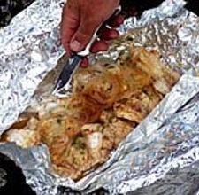 How to Bake Fish Using Aluminum Foil:   One of many ways fish can be baked in aluminum foil.   Crave that old fish recipe, but don't know how to bake fish in aluminum foil? Read on to find the tips you need to know to become an expert at using aluminum foil to bake the perfect fish filet! Things You'll Need:   Aluminum foil,   Fish,   Your favorite butters, oils, or spices,   Baking pan.   1. First of all, measure the thickness of the fish. You'll want to know this to know how long to cook. Figure about ten minutes of cooking per thick inch of fish. Fish has to cook at high temperatures, so preheat oven to around 425-250. 2.   Spread the aluminum foil over the baking pan and spray with non stick spray. 3. Use whatever recipe you have for a marinade/cooking juices. Since you're using aluminum foil in an oven, basically you're steaming the fish and so you need some butter, marinade, or cooking juice. If you're working to impress someone, a white wine marinade is a great choice. 4.   Wrap each fillet in its own aluminum foil, along with some juice and veggies, if desired. Wrap tightly, and place them on the aluminum covered baking pan. 5.   Bake for the prescribed amount of time, according to fillet thickness. The fish is ready when it is white and flaky, falling apart easily. Don't overcook. 6.   Repeat and practice until you're a master fish chef! How To Bake Fish, How To Bake Salmon, Grilled Walleye, Bake Fish, Bake Salmon, Fish Filet, Walleye Recipes, Walleye Fish Recipes, Salmon In Foil