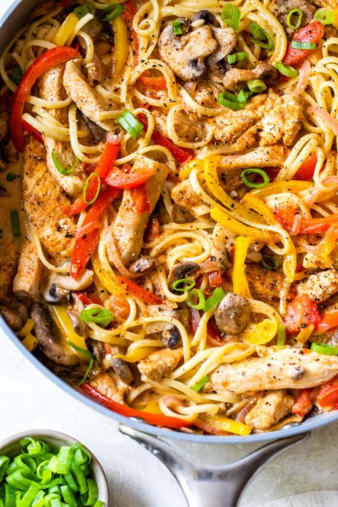 Cajun Chicken Pasta is packed with chicken strips, bell peppers, red onion, mushrooms, and scallions in a light, creamy Cajun sauce. #pasta #chicken #dinner #healthyrecipes #chickenbreast #cajun Low Calorie Pasta Recipes, Creamy Cajun Chicken Pasta, Low Calorie Pasta, Creamy Cajun Chicken, Cajun Chicken Pasta Recipes, Cajun Pasta, Cajun Chicken Pasta, Cajun Chicken, Chicken Pasta Recipes