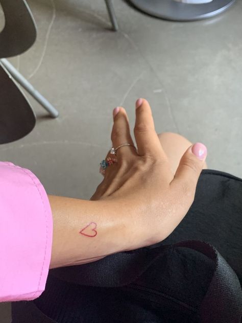 Back Of Arm Heart Tattoo, Small Pink Tattoo, Heart Tattoo On Arm, Pink Tattoo Aesthetic, Heart Arm Tattoo, Pink Heart Tattoo, Heart Tattoo Arm, Hand Heart Tattoo, Red Heart Tattoo