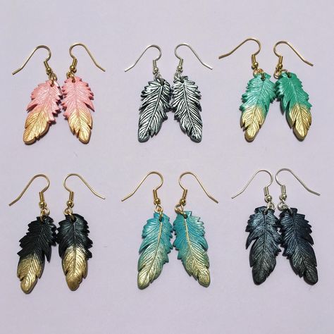 Faux feather earrings made with polymer clay! Available in 6 colours at $26 AUD a pair. Feather Clay Earrings, Faux Feathers, Resin And Polymer Clay, Polymer Clay Jewellery, Clay Sculptures, Polymer Clay Sculptures, Clay Jewellery, Clay Jewelry Diy, Gold Dipped