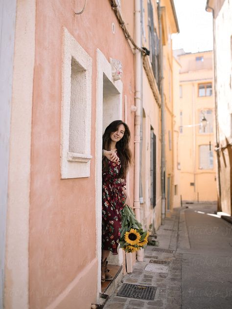 photo by Alexandr Ivanets from Stocksy United. Doorway Poses, Doorstep Photography, Door Poses, Standing In Doorway, Bunch Of Sunflowers, Old Door, Pictures Of People, Woman Standing, How To Pose