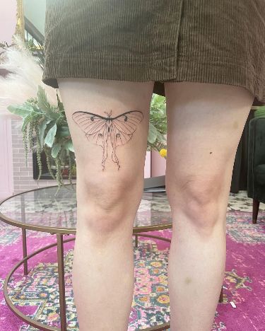 Fine Line Thigh Tattoo Above the Knee: Luna Moth Elegance Fine Line Above Knee Tattoo, Fine Line Thigh Tattoo, Moth Tattoo Thigh, Moth Thigh Tattoo, Above The Knee Tattoos Women, Above Knee Tattoos Women, Above The Knee Tattoo, Luna Moth Tattoo, Above Knee Tattoo