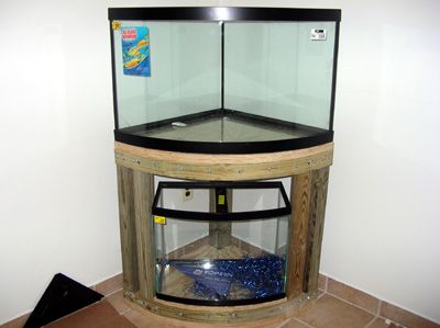 28 DIY Aquarium Stands | Guide Patterns Corner Fish Tank Ideas, Corner Aquarium Ideas, Corner Fish Tank, Aquarium Rack, Smart Home Design Ideas, Corner Aquarium, Aquarium Table, Diy Aquarium Stand, Turtle Tanks