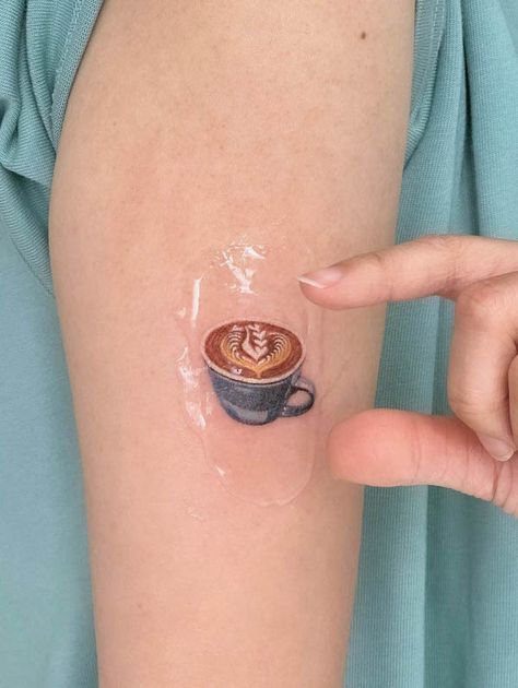 Coffee Finger Tattoo, Chipped Tea Cup Tattoo, Tiny Coffee Cup Tattoo, Coffee Art Tattoo, Croissant And Coffee Tattoo, Dainty Coffee Tattoo, Coffee Cup With Flowers Tattoo, Coffee Shop Tattoo, Coffee Themed Tattoos