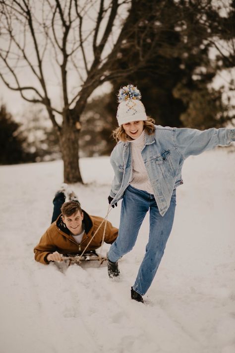 Snowy engagement session of this sweet couple playing in the snow and sledding.

Lincoln, Nebraska Outfits For Snow Photoshoot, Sledding Photoshoot, Sled Photoshoot, Snow Couple Photoshoot Photo Ideas, Winter Outdoor Photoshoot, Couple Photography Winter, Winter Family Pictures, Winter Vacation Outfits, Snow Couple