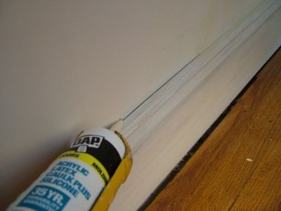 This ugly crack between the wall and baseboard will disappear once caulk fills the gap. PHOTO CREDIT: Tim Carter Caulk Baseboards, Caulking Tips, Home Fix, Mediterranean Decor, French Doors Interior, Home Repairs, Baseboards, Repair And Maintenance, Home Maintenance