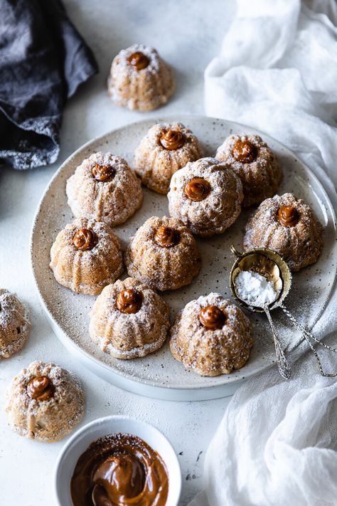 Mini Bundt Cake Packaging Ideas, Mini Cinnamon Roll Bundt Cakes, Mini Cinnamon Bundt Cakes, Mini Bundt Cake Flavors, Mini Fluted Cake Pan Recipes, Fall Mini Bundt Cakes, Christmas Mini Bundt Cake Recipes, Mini Christmas Bundt Cakes, Christmas Mini Bundt Cakes