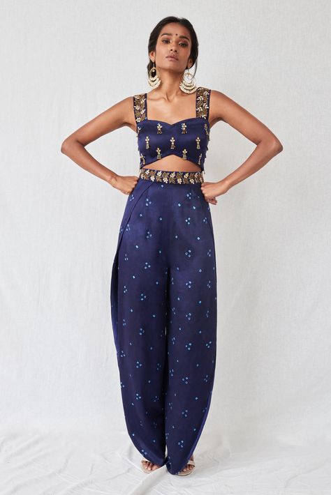 Bandhani jumpsuit in midnight blue with a princess neckline with sequin and tassel embroidery all over the bust and cut-dana and stone embroidery on the straps and waist. The top has a cut-out detail at the waist and the pants are wrap-around style with openings at the sides Desi Jumpsuit, Crop Top Ideas, Ladies Crop Top, Tassel Embroidery, Goa Wedding, Stone Embroidery, Trendy Outfits Indian, Mehendi Outfits, Indian Outfits Lehenga