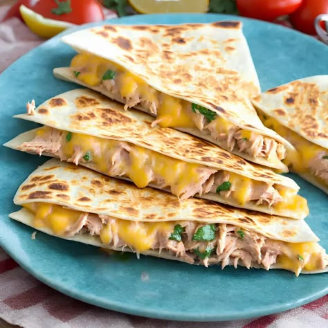 This tuna quesadilla recipe has a crisp exterior and a melt-in-your-mouth filling of tuna and sweetcorn. Canned tuna and sweetcorn topped with gooey melted cheese in a tasty tortilla sandwich. Tuna is a popular food among all people, and this recipe is no exception. Every bite is bursting with flavour and cheesy goodness. This recipe […] The post Tuna Quesadilla appeared first on Scrumptiously. Tuna And Sweet Corn Sandwich, Tuna Sweetcorn Sandwich, Tuna Melt Tortilla, Tuna Corn Sandwich, Chicken Tuna Recipes, Tuna Cheese Melt, Tuna Melt Quesadilla, Tuna Quesadilla Recipes, Tuna Tortilla Wrap