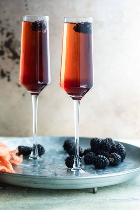 Two Kir Royale cocktails in champagne flutes on a metal tray. Kir Royale Recipe, Kir Royale Cocktail, Recipes For A Party, French Cocktails, Kir Royale, Raspberry Liqueur, Copycat Restaurant Recipes, Circle Bag, It Bag