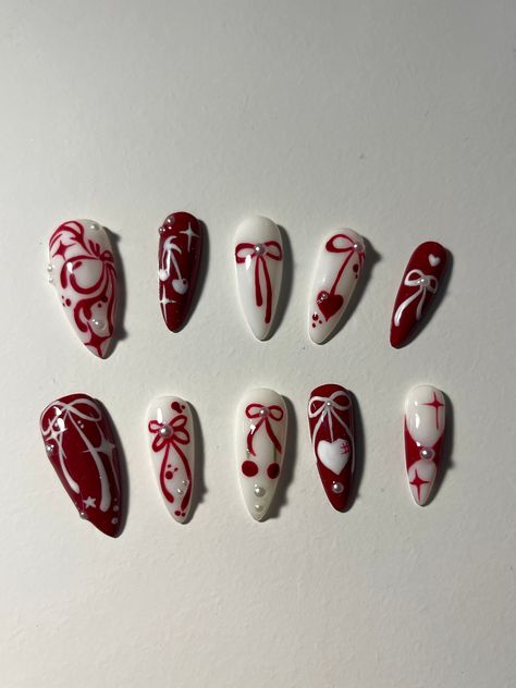 --> Nail shape + length: medium stiletto 🌸 ** if you want a different shape, make sure to include it in the personalization section 🎀All orders ship with a file, nail glue, cuticle pusher and stickers :D 🎀If you need custom sizes make sure to include it in the personalization section!! **there might be slight differences in the nail art as they are a handmade product** IG: @stxrnails Red Nails Alternative, Christmas Nail Mistletoe, Sultry Red Nails, Read Nails Design, Christmas Nails Unique Art Designs, Chinese Halloween Nails, Nail Inspo 11-12 Yo, Red Nail Fall Design, Nail Inspiration Red And Black