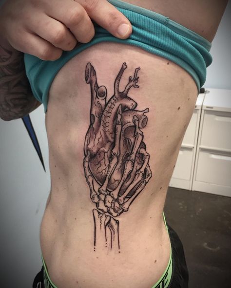 Skeleton Hand Holding Hourglass Tattoo, Skeleton Holding Heart Tattoo, Skeleton Hand Holding Heart Tattoo, Skeleton Nurse Tattoo, Skeleton Hand And Human Hand Tattoo, Anatomy Tattoo Sleeve, Hand Holding Heart Drawing, Heart In Hand Tattoo, Skeleton Heart Tattoo