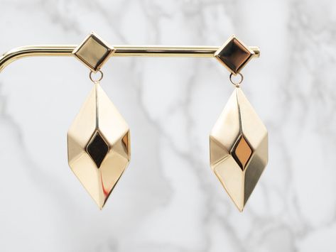 Wow! Make a statement in these geometric drop earrings! The lightweight diamond-shaped drops are sure to look great from day to night. Secure backs keep the earrings comfortably in the ear. Metal: 14K Yellow GoldEarrings Width: 19.5 mmEarrings Length: 57.5 mmMarks: "ITALY * 351 VI 14Kt" Stamped on the reverse School Jewelry, Rose Gold Band, Minimal Jewelry, The Ear, Gold Geometric, White Gold Band, Yellow Gold Earring, Gold Cross, Diamond Shaped