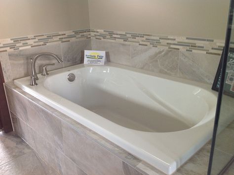 A drop in bathtub is a bathtub that has no finished or cut sides and is usually placed or dropped into an open surface. Tile Around Bathtub, Tile Tub Surround, Bathtub Surround, Tub Sizes, Gray Tile, Grey Bathroom Tiles, Drop In Tub, Jetted Bath Tubs, Drop In Bathtub