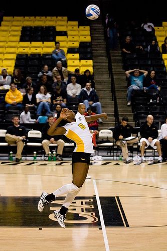 A server can take a 3-4 step approach behind the service line and in the air contact the top third of the ball so it spins as it crosses the court. This is called a jump topspin serve. (Henry Stern) Volleyball Court Size, Volleyball Terms, Volleyball Sayings, Volleyball Dig, Volleyball Rules, Volleyball Things, Volleyball Serve, Volleyball Equipment, Youth Volleyball