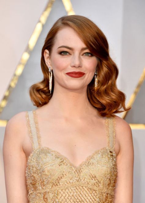 Bombshell Waves Emma Stone's red lob at the 2017 Oscars lent itself perfectly to some Old Hollywood waves, while side-swept bangs helped to elongate the appearance of her face. See more haircuts that are perfect for round face shapes at GoodHousekeeping.com. New Blonde Hair, Emma Stone Hair, Red Carpet Hair, Hollywood Waves, Round Face Haircuts, Short Wedding Hair, Emma Stone, Red Lipstick, Mode Inspo