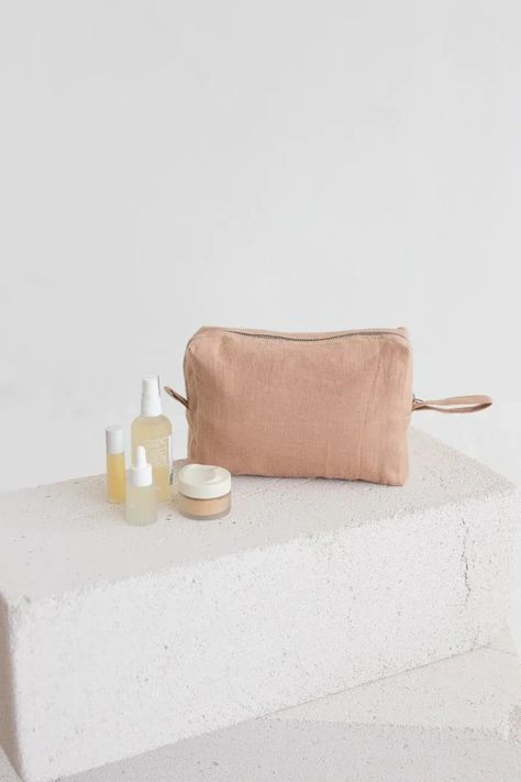 Stay organized and stylish on the go with our waterproof cosmetic bag or travel pouch. Double-layered linen makeup bag features a secure zipper closure to keep your essentials safe and dry. #linenmakeupbag #linentravelpouch #waterproofmakeupbag #sandsnowlinen Linen Bags, Linen Layers, Festive Wedding, European Linens, Linen Towels, Linen Bag, Slow Living, Cosmetic Pouch, Travel Pouch