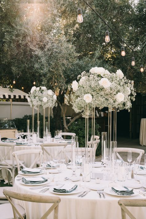 Wedding Flower Arrangements For Round Tables, Rustic White Wedding Decor, White Flower Table Arrangements Wedding, Talk Centerpieces Wedding, Wedding White Flower Arrangements, White Wedding Flower Decor, White And Clear Wedding Decor, Extravagant Wedding Flowers, White Wedding Flowers Table Decor