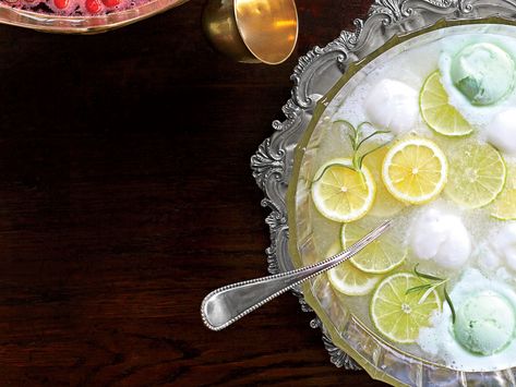 Lemon-Lime-Rosemary Punch | Every baby shower and holiday party in the South will welcome a festive punch bowl with mounds of sherbet floating on top. Put a fragrant spin on this classic citrus punch for a refreshing, tart, herb-infused beverage. Easter Punch Recipes, Easter Punch, Christmas Mocktail, Spring Feast, Shower Punch, Party Beverages, Shower Checklist, Holiday Punch Recipe, Alcoholic Punch Recipes