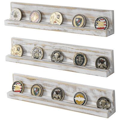 Elevate the presentation of your coin or medallion collection with this set of 3 decorative whitewashed wooden floating racks. Each shelf features a groove that securely holds small plaques, making it ideal for displaying honorary awards alongside corresponding coins or medals. These coin holder shelves are perfect for showcasing commemorative medals or pins for military service members, veterans, and challenge coins for law enforcement personnel, police officers, and firefighters. Crafted from Coin Collection Display Ideas, Challenge Coin Display Diy, Closet Boxes, Coastal Ideas, Challenge Coin Holder, Metal Floating Shelves, Trophy Display, Military Coins, Challenge Coin Display