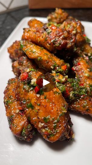 1.8K views · 282 reactions | Chimichurri Wings 🌿🧄🌶  • Y’all gotta try these. They’re garlicky, a little spicy and has the right amount of freshness from the herbs. I tried these one day when I had some Chimichurri sauce leftover from when I made some steak bites. I decided to toss it with some xtra crispy wings in made in the air fryer and now I can’t stop making them 🤤  • Chimichurri sauce is usually served with grilled meats so I’m gonna try it on some grilled wings next. I just know that’s gonna be 🔥🔥 • TIPS: 1. Add a little cornstarch to the wings to get them xtra crispy  2. Air fry on 400 For 12 mins, then flip and air fry for another 5 mins.  • Store Run 📝 Chicken wings Fresh flat leaf Parsley  Fresh garlic (minced) Lemon juice Fresno Chili pepper  Dried oregano  Red wine vine Chimchiri Sauce Recipe, Chimichurri Wings, Chimmi Churri Sauce Steak, Chimmi Churri Sauce Cilantro, Grilled Chicken Chimichurri, Chimchiri Sauce Steak, Chili Chicken Wings, Fresno Chili, Wine Vine