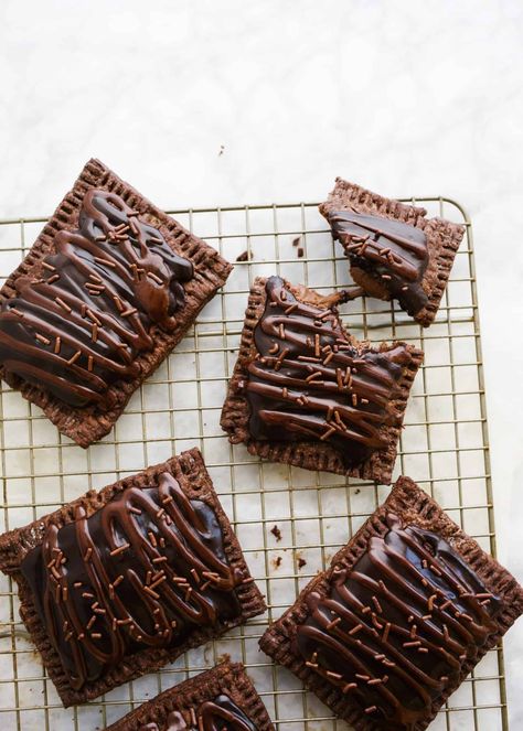 These double chocolate pop-tarts feature a cocoa powder pie dough, a double chocolate filling, and a simple chocolate sugar glaze! Chocolate Poptart, Chocolate Pop Tarts, Pie Dough Recipe, Chocolate Pops, Shortbread Bars, Pop Tart, Chocolate Pies, Chocolate Filling, Pie Dough