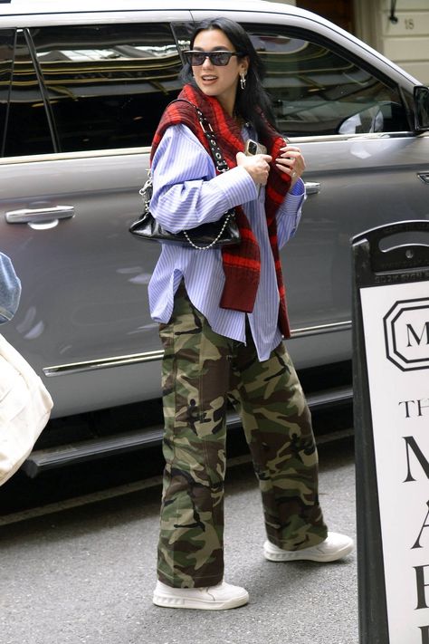 Dua Lipa looks cool in camo pants paired with a blue dress shirt and Valentino sneakers while stepping out in New York City-030523_10 Camo Pants Outfit Winter Street Styles, Camuflage Outfit Pants, Blue Camo Pants Outfit, Blue Pants Outfit Men, Dua Lipa Looks, Womens Camo Pants, Blue Camo Pants, Camo Pants Outfit, Pants Outfit Ideas