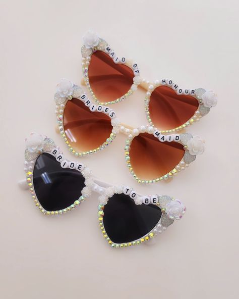 Hello Spring Brides 🤍 Have you seen our dreamy Bride Sunnies? Yeah, you see them everywhere, and heck, even Temu sells them; but what makes ours different is that when you purchase from us, 100% your sunglasses are carefully and lovingly hand bedazzled by me, keeping in mind why you chose us in the first place. 🤍 Your sunny will be adorned with Rhinestones and Pearls that we have picked and used since we have started, and thought to be the best ones. They are placed carefully where they co... Dreamy Bride, Bride Flower, Diy Jar Crafts, Ivory Flower, Bride Flowers, Hens Night, Wife Life, Ivory Flowers, Ivory Pearl