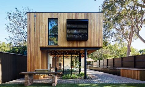 Park House. Architecture studio tenfiftyfive paired modern luxury with sustainable and nature-centric design in their design of this gorgeous house extension in Melbourne. This Instagram-worthy dwelling is built around two mature gumtrees and clad in timber to blend into the surroundings. More than just a pretty picture, this stylish abode also boasts energy-efficient principles as well as a natural-materials palette largely foraged from recycled and salvaged items. Stilt House Design, Wood House Design, Modern Wooden House, Wooden House Design, Industrial Home Design, Bali Resort, House On Stilts, House Design Exterior, Park House