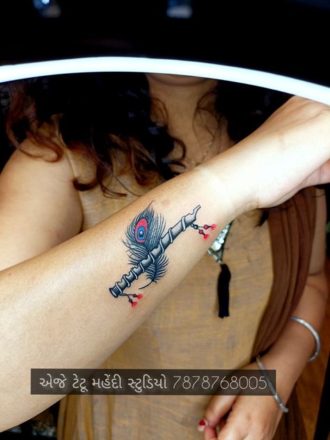 Morpinch tattoo / flute tattoo Murli Krishna Tattoo, Sri Krishna Tattoo Designs, Basuri Flute Tattoo, Basuri Krishna Flute Tattoo, Morpinch Tattoo, Radha Krishna Tattoo On Hand, Krishna Tattoo Small For Women, Krishna Flute Tattoo, Radha Krishna Tattoo