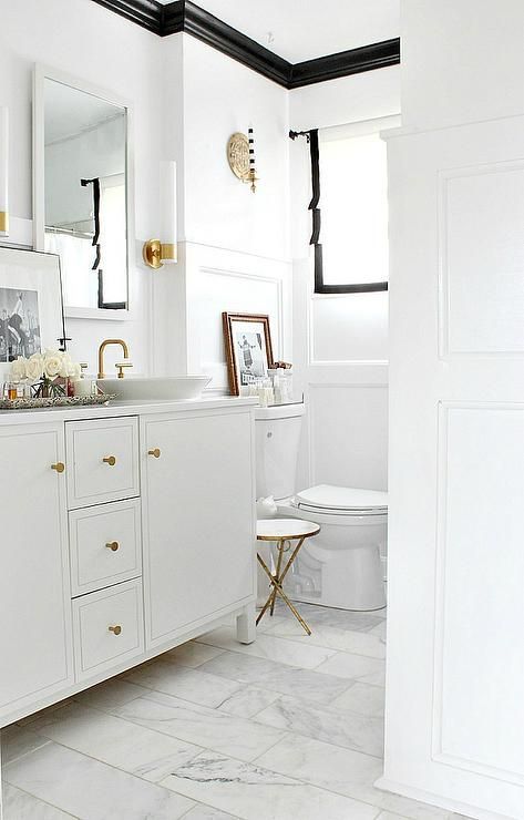 Black and white bathroom features white walls finished with black crown moldings lined with a ... Black Crown Molding, Molding Bathroom, Crown Molding Bathroom, Touchless Kitchen Faucet, Best Kitchen Design, Casa Clean, Farmhouse Side Table, Apartment Decoration, Transitional Bathroom