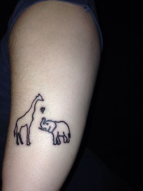 Elephant and giraffe for the new baby and Addie, something like this I'm getting:)) Elephant Giraffe Tattoo, Elephant And Giraffe Tattoo, Simple Giraffe Tattoo, Baby Giraffe Tattoo, Giraffe Tattoo Ideas, Small Giraffe Tattoo, Elephant Family Tattoo, Giraffe Tattoo, Tattoo Elephant