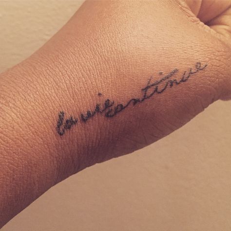 Vis Ta Vie Tattoo Meaning, La Vie Continue Tattoo, Continue Tattoo, Life Is Beautiful In French Tattoo, Cest La Vie Tattoo Fonts, Cest La Vie Tattoo Ribs, C’est La Vie Tattoo Ideas, Hand Tattoo, Hand Tattoos