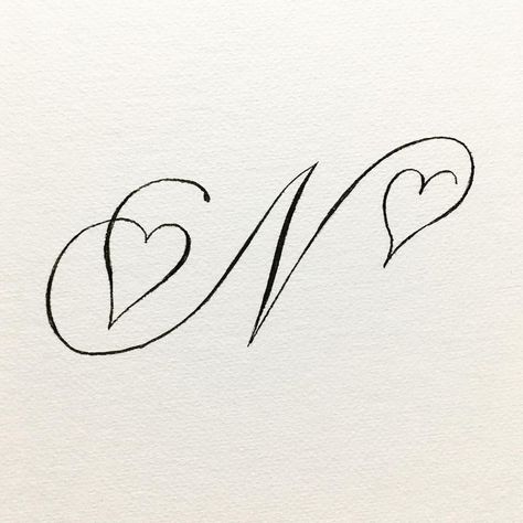 A love-ly capital N. Tag a lovely friend Written with a Tombow brush pen. save, share, comment… | Instagram Tombow Brush Pen, Pretty Handwriting, Tattoo Lettering Fonts, Dainty Tattoos, Lettering Styles, Letter N, Dope Tattoos, Tattoo Lettering, Pretty Tattoos